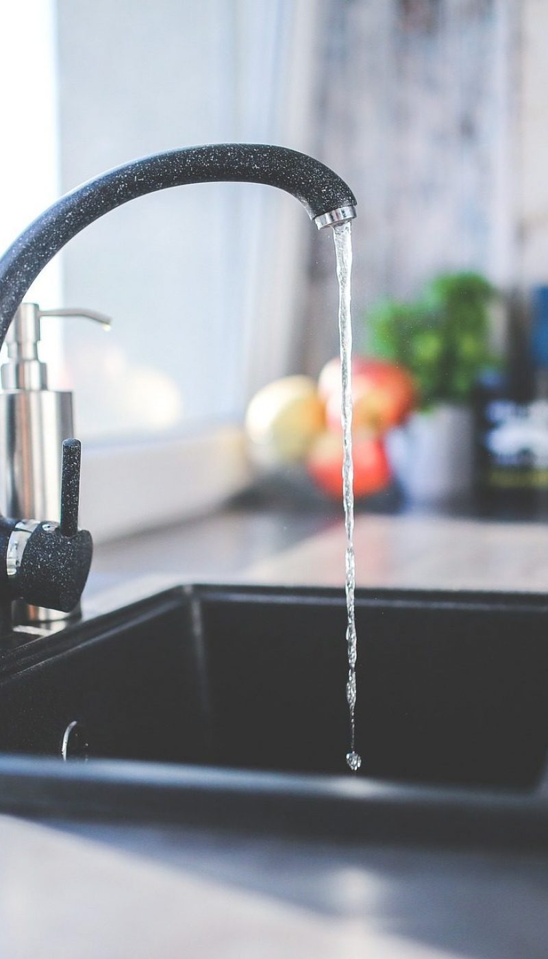 Water Running Out of a Faucet in a Kitchen